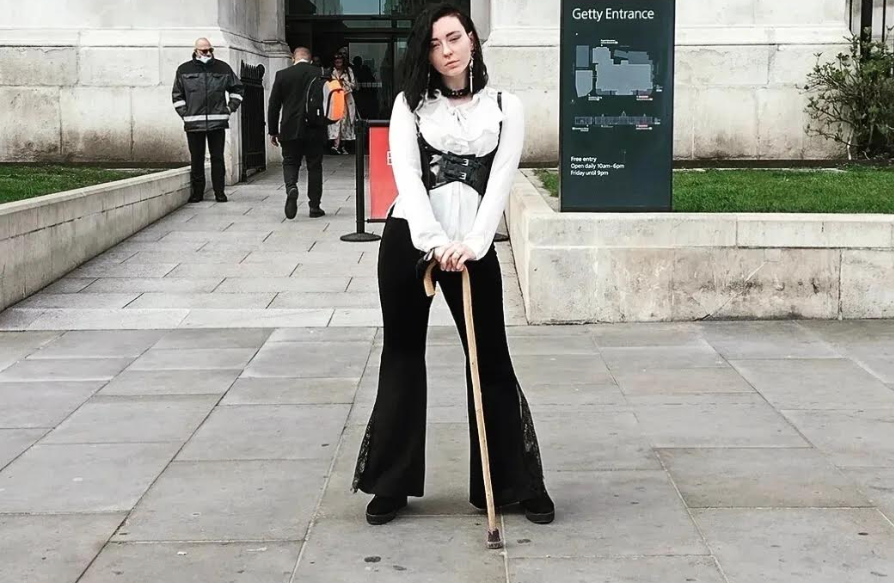 Lucy with her cane at a gallery