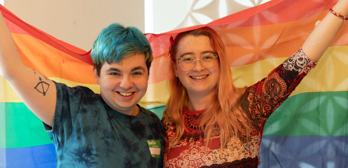 LGBT volunteering Manchester: Volunteers waving the Pride flag